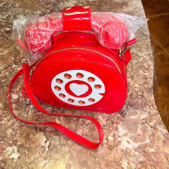 Handbags - NWB telephone crossbody that connects to phone for Music